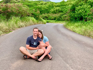 Mak and Kyle sitting on the road in Maui