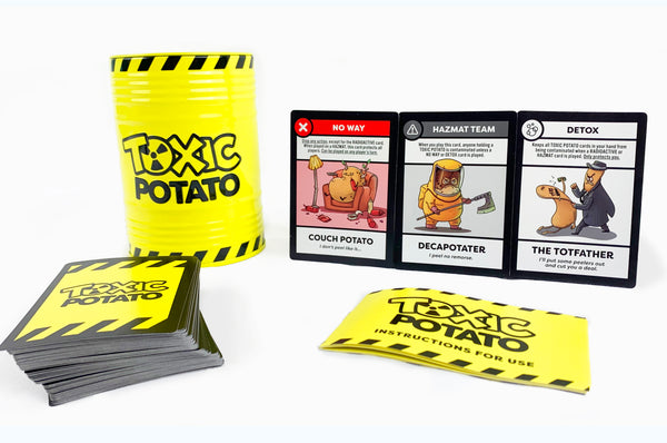 Toxic Potato Base Game card deck, packaging, and instructions for use with a few different Toxic Potato cards and characters propped up